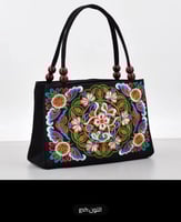 حقيبة يد مطرزة بالزهور