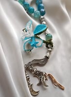 سبحة 33 عقيق برازيلي أزرق سماوي مزينة بوردة أويا ك...