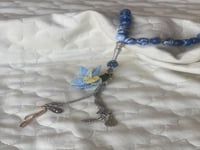 سبحة 33 عقيق برازيلي أزرق مزينة بوردة أويا كروشيه