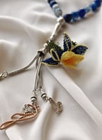 سبحة 33 عقيق برازيلي أزرق مزينة بوردة أويا كروشيه