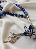 سبحة 33 عقيق برازيلي أزرق مزينة بوردة أويا كروشيه