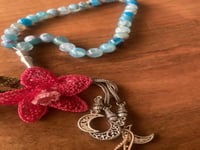 سبحة 33 عقيق برازيلي أزرق مزينة بوردة أويا كروشيه