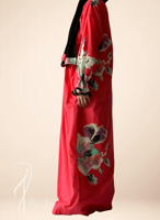 شرشف صلاة لف منقوش فوشي واسود و الطرحة مثبتة .