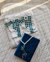 شرشف صلاة لف ابيض مزين بالكروشيه ترتر ازرق من لاجو...