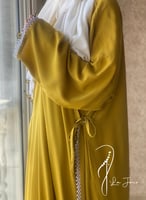 شرشف صلاة لف كموني أصفر مستردة مزين بالكروشيه و ال...