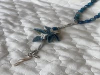 سبحة 33 عقيق برازيلي أزرق مزينة بوردة أويا كروشيه