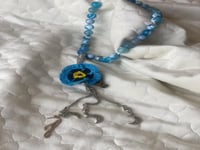 سبحة 33 عقيق برازيلي أزرق مزينة بوردة أويا كروشيه