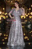 فستان سهرة 4215 فضي لامع مطرز بتصميم فاخر وأكمام ق...