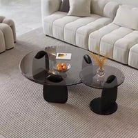 طقم طاولتين ضيافة أرضي خشب أسود سطح زجاج دائري أسو...