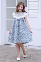 فستان تل بورود متداخلة وأبه كبيرة مزينة باللؤلؤ