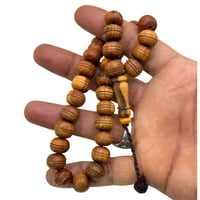 سبحة خشب زيتون فواحه معتقه في دهن الزعفران الملكي