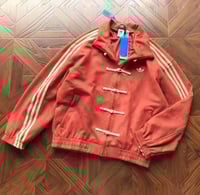 جاكيت أديداس الرسمي