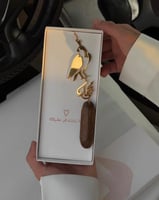 تعليقة الصقر للسيارة بالاسم