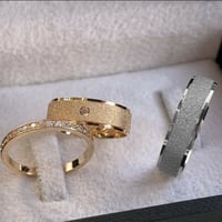 طقم راقي بدبلتين مع محبس أنيق من الفضة الخالصة الم...