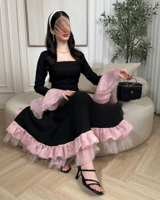 فستان عيد أسود بتفاصيل كشكش وردية