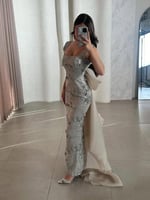 فستان سهرة فاخر بكلفة ورد بارز مع ذيل جازار