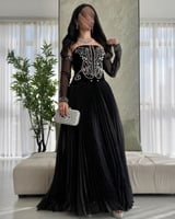 ارتدي الفخامة مع فستان رمضاني أسود طويل بتطريز يدو...