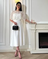 فستان "باربي" الأبيض بكلفة الخرز الفاخرة