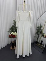 فستان باربي الأبيض بتطريز ورد اليدوي