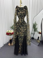 فستان سهرة تول أسود مطرز بزهور ذهبية وفصوص الزركون...