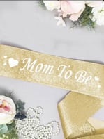 وشاح ذهبي للأم لحفل كشف جنس الجنين