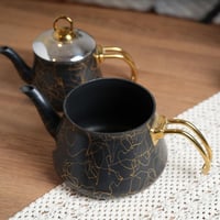 طقم ابريق شاي بتصميم عصري لون اسود وذهبي مقاس 27x2...