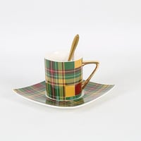فنجان قهوة مخطط أخضر وأصفر من البورسلين مع صحن و م...