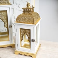 مجموعة فوانيس رمضانية أنيقة باللونين الأبيض والذهب...