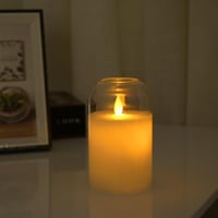 شمعة ديكور بإضاءة هادئة داخل غطاء زجاجي ارتفاع 18...