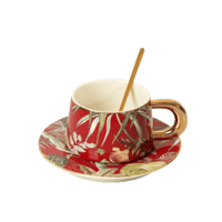 فنجان قهوة بتصميم زهور مع صحن لون احمر