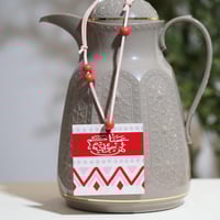 تعليقة ترامس بعبارة عساكم من عواده – لون أحمر