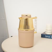 ترمس الشاي والقهوة بتصميم مميز باللون البيج والذهب...