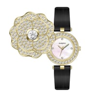 ساعه نسائيه بروشا جلد اسود ذهبي ميناء صدف