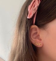 حلق نسائيه بالاسم