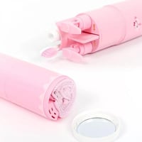 منظم فرشاة ومعجون مع مستلزمات لون وردي