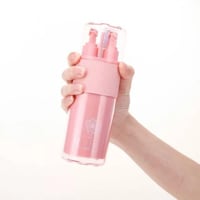 منظم فرشاة ومعجون مع مستلزمات لون وردي