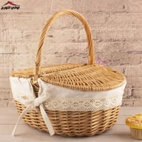 سلة خيزران بيضاوي بغطاء وقماش اطراف دانتيل