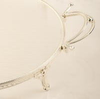 تبسي دائري رنيم فضي