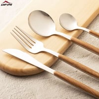 طقم ملاعق فضي بيد خشب 24 قطعة