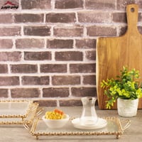 تبسي نسرين زجاج بإيطار ذهبي