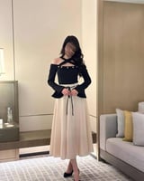 فستان العيد للسن المحير باللونين الأسود والبيج