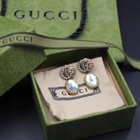 أقراط ماستر بشعار قوتشي كريستالية