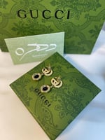 أقراط ماستر بشعار قوتشي كريستالية