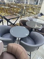 كرسيين قماش وطاولة زجاج عدة ألوان