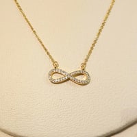 سلسال انفنتي ذهبي زركون