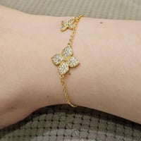 اسوارة روبرتو كوين وردات ذهبية مرصعة باحجار