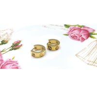 حلق كارتير لوف ذهبي