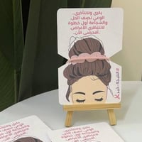 توزيعات التوعية من سرطان الثدي مع ربطة يد