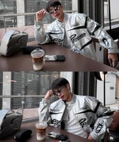 Hellstar's red bomber jacket is decorated with a b...