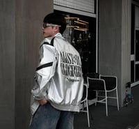 Hellstar's red bomber jacket is decorated with a b...